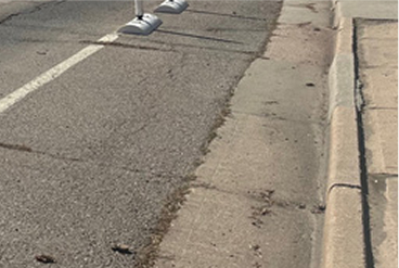 Sidewalk that Contains Deflections at least 5 feet wide